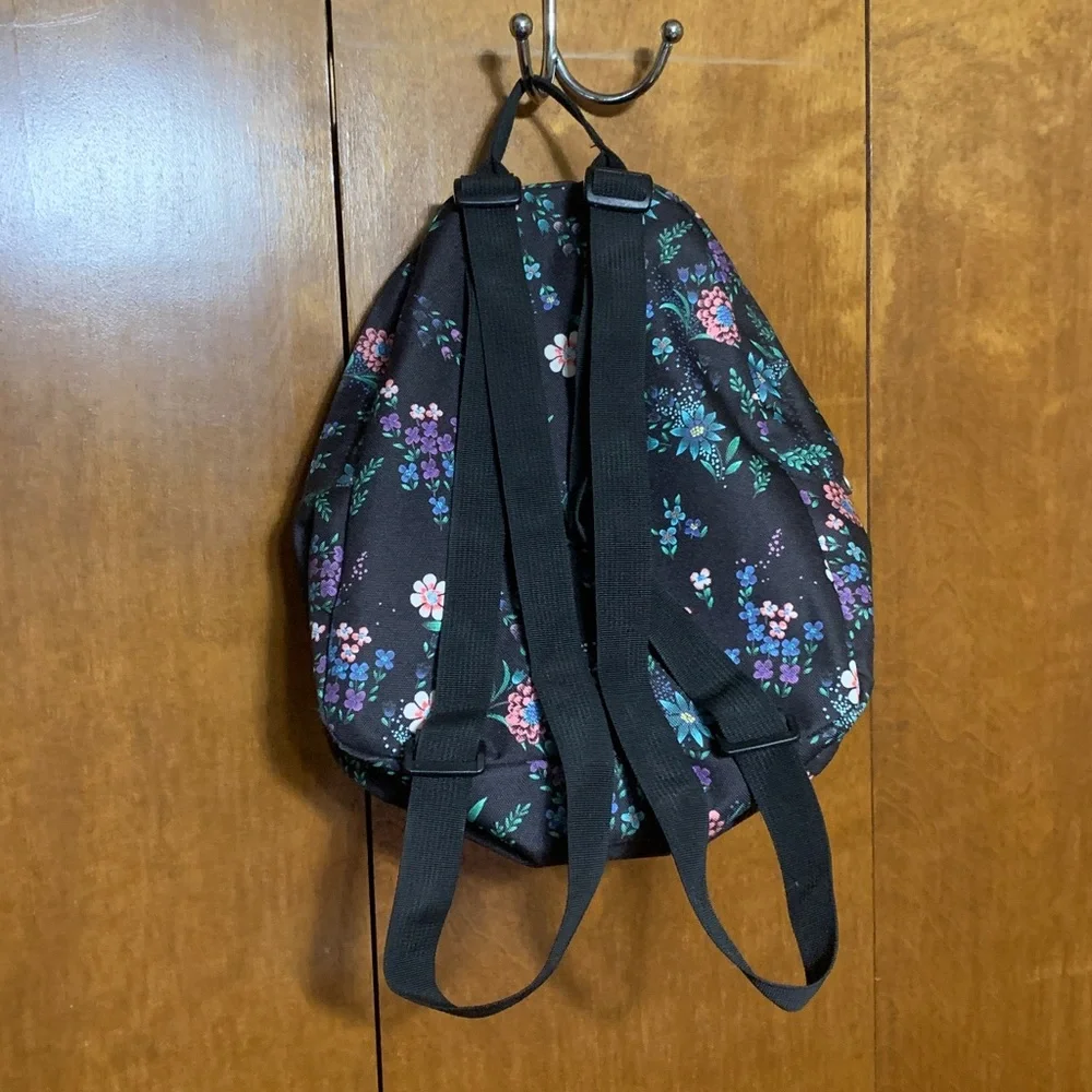 Jansport Black Mini Backpack with Pink, Purple & Green Floral Print.